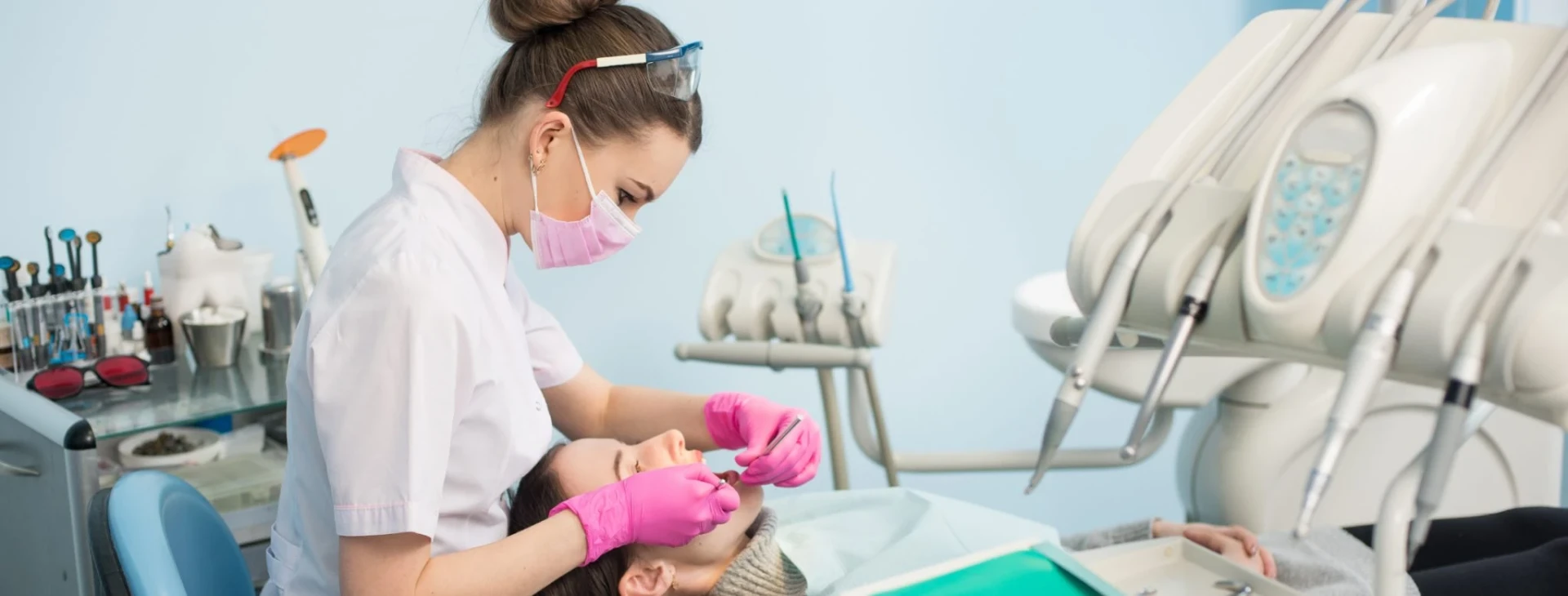 Dental clinician working with modern speciality treatment equipment